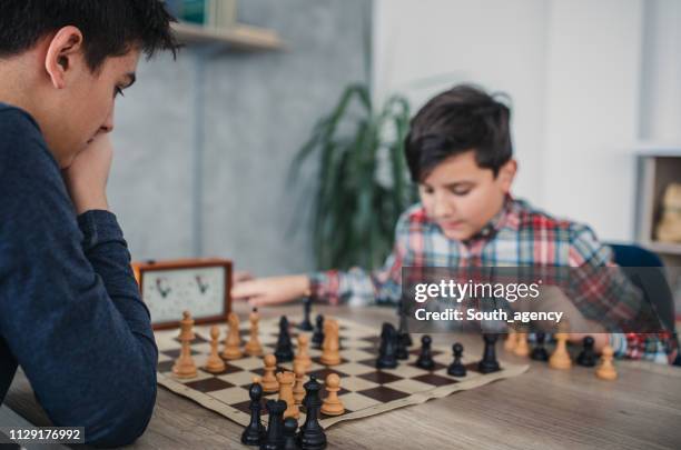 kids playing chess - chess timer stock pictures, royalty-free photos & images