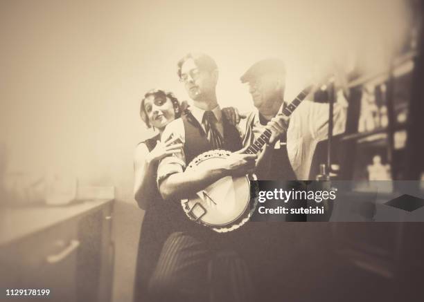 fun with the banjo player in the bar!!! - speakeasy stock pictures, royalty-free photos & images