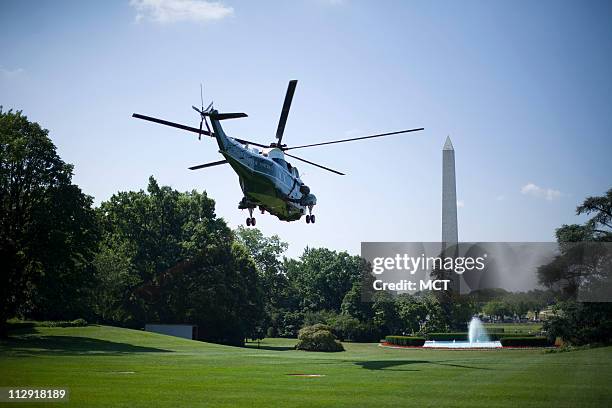 President George W. Bush, aboard Marine One, departs the South Lawn of the White House in Washington, July 1, 2008. Bush is travelling to Mississippi...
