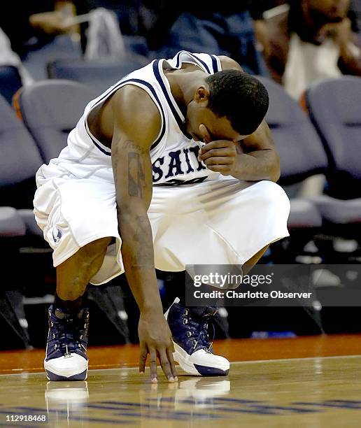 St. Augustine's Antonio Fitzgerald bows down on the court after his team was upset by Elizabeth City State University 84-73 during the quarterfinals...