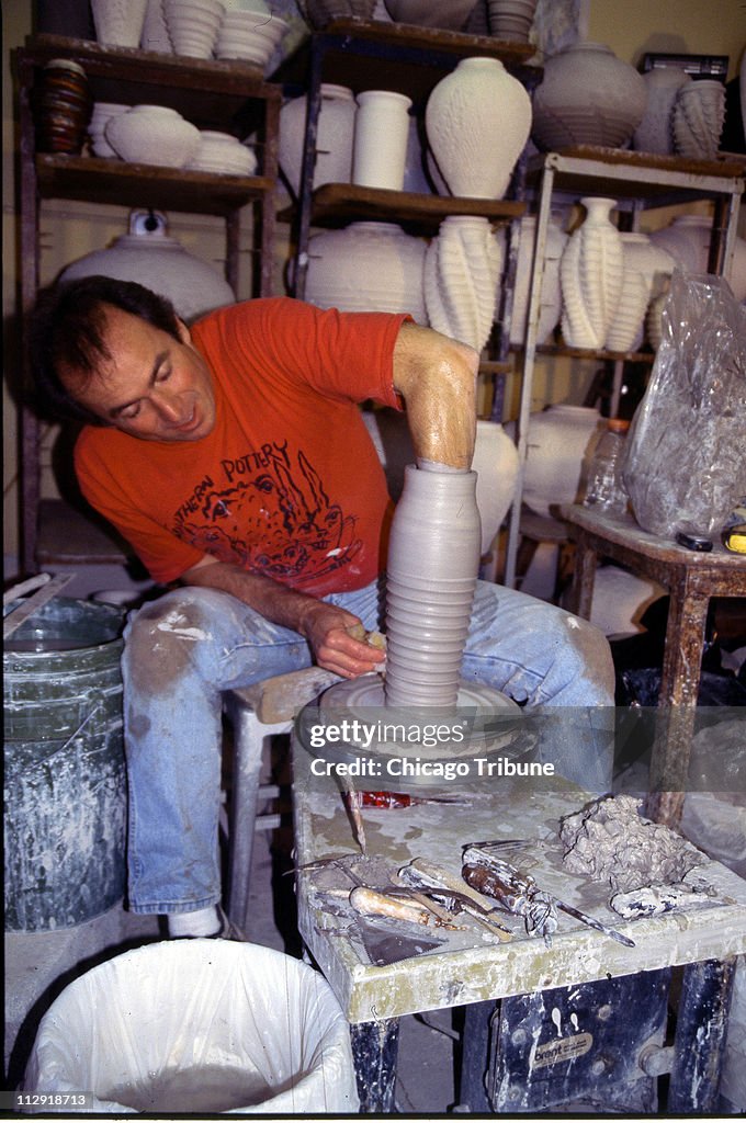 Potter Bruce Odell demonstrates his skills at his studio nea