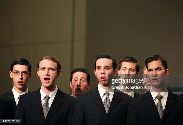 young men's choir sings. - man singing stockfoto's en -beelden