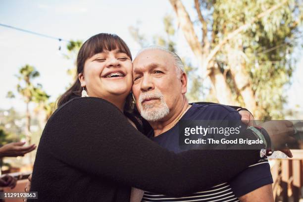 Granddaughter hugging grandfather