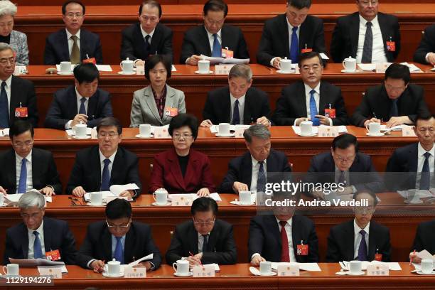 Deputies of the National People's Congress listen to Vice Chairman of the Standing Committee of the NPC Wang Chen's speech, during the second plenary...