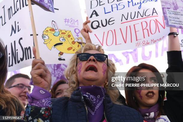 Protesters shout slogans during a demonstration marking International Women's Day in Madrid on March 8, 2019. - For the second year running, Spanish...