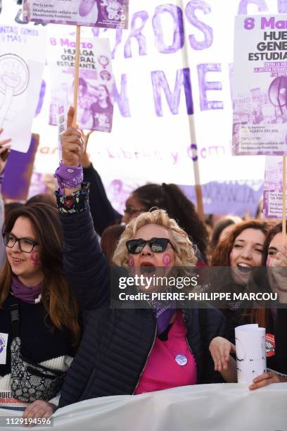 Protesters shout slogans while holding signs reading "General student strike against macho violence, patriarchal and Francoist justice, and...