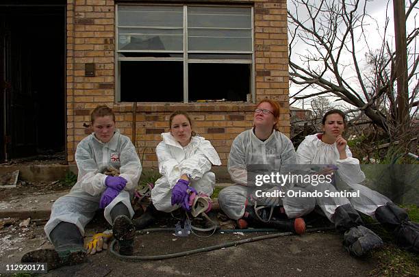 Stetson University students Skylar Simmons Jessica Simons Heston McCranie and April Buchert take a break near the end of their first day of work this...