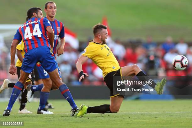 Marco Simic of Persija Jakarta contests the ball with Nikolai Topor-Stanley of the Newcastle Jets during the AFC Champions League Second Round...