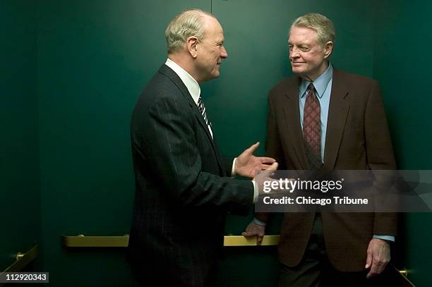 In an elevator between stops on a busy day of campaigning, former University of Oklahoma football coach Barry Switzer, left, discusses similarities...