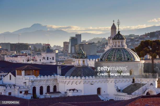 la compañía church and volcano cotopaxi at sunrise - quito stock pictures, royalty-free photos & images