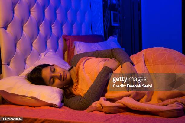 pregnant woman is having a nap - stock image - asian sleeping stock pictures, royalty-free photos & images