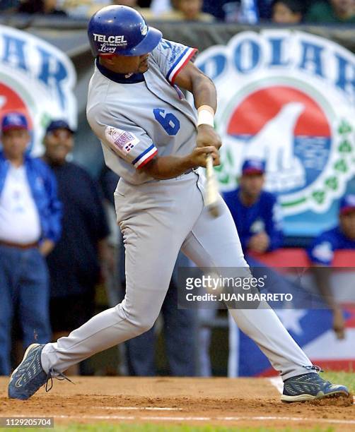 Israel Alcantara of the Dominican Republic's Tigres del Licey swings the bat during the Caribbean Series game against the Puerto Rican Vaqueros, 02...