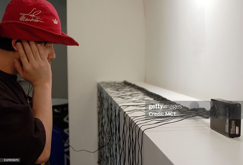 Tokyo, Japan artist Naohiro Ukawa uses 55 microphones attached to a personal stereo in his installation in an exhibit on things that are in danger of disappearing under a new Japanese law regulating old appliances and electronics.