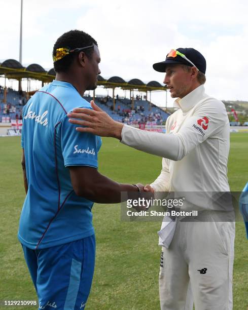 Joe Root of England shakes hands with of the West Indies following England's Victory during Day Four of the Third Test match between the West Indies...
