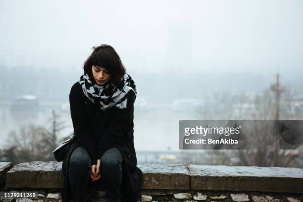 girl, alone. - seasonal sadness stock pictures, royalty-free photos & images