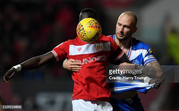 Famara Diedhiou of Bristol City is challenged by Toni Leistner of Queens Park Rangers during the Sky Bet Championship match between Bristol City and...