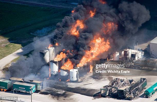 Storage tanks burn at Barton Solvents in downtown Valley Center, Kansas, Tuesday, July 17, 2007. Hundreds of people were evacuated after the...