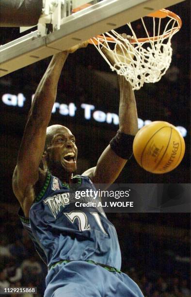 Minnesota Timberwolves' Kevin Garnett slams the ball in the first quarter against the Memphis Grizzlies 06 December 2001 at The Pyramid in Memphis,...