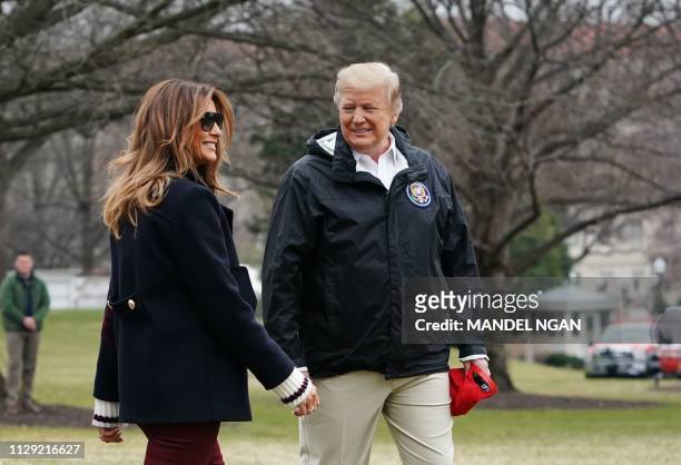President Donald Trump is joined by First Lady Melania Trump to board Marine One before departing from the South Lawn of the White House on March 8,...
