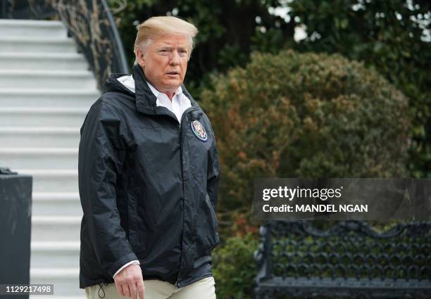 President Donald Trump approaches reporters to speak before departing from the South Lawn of the White House on March 8, 2019 in Washington, DC....