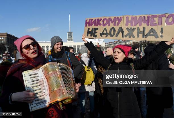 Feminist activists take part in a rally for gender equality and women's rights in Saint Petersburg, on March 8 as International Women's Day is being...