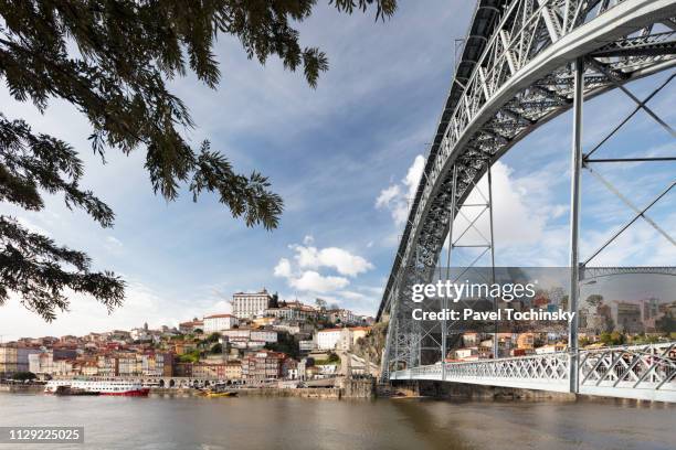 dom luis i bridge with porto's historical ribeira district, portugal - ribeira porto stock pictures, royalty-free photos & images