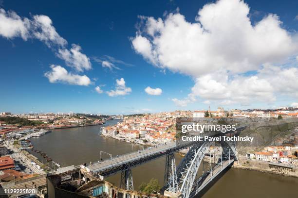 dom luis i bridge with porto's historical ribeira district, portugal - iron wine stock pictures, royalty-free photos & images