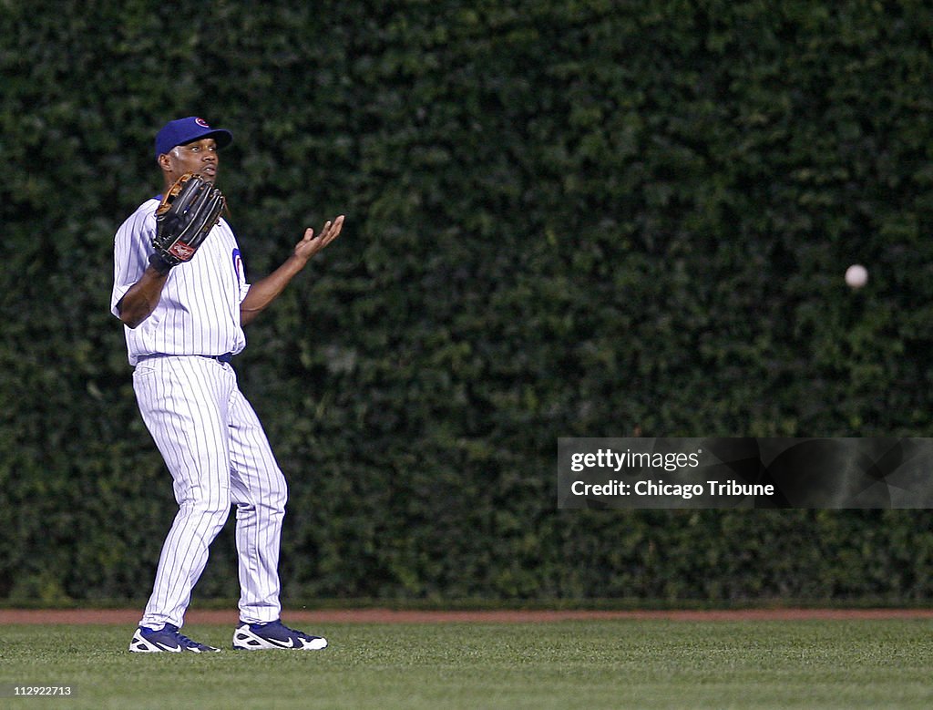 Chicago Cubs centerfielder Jacque Jones motions that he can'