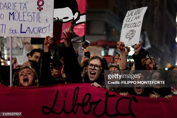 Women from the feminist movement "Non Una Meno" take part in a protest march in Rome on March 8, 2019 on International Women's Day, over numerous...