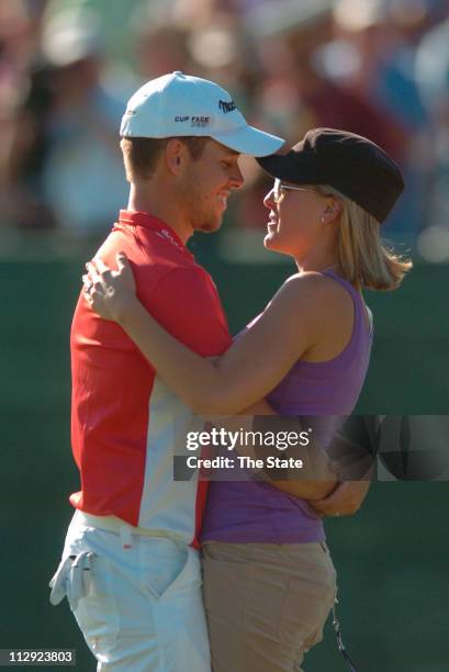 Aaron Baddeley, left, hugs his wife, Richelle Baddeley, right, after winning the 2006 Verizon Heritage of Golf on Harbour Town Golf Links in Hilton...