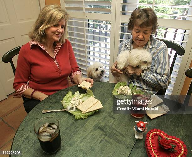 Barbara Pruitt, left, got a visit from her mother, Lorayne Melgaard, who brought along Laci, who wanted to say hello to Pruitt's pooch, Cody.