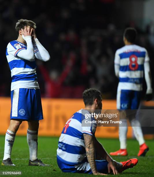 Members of the Queens Park Rangers side cut dejected figures after conceding a penalty during the Sky Bet Championship match between Bristol City and...