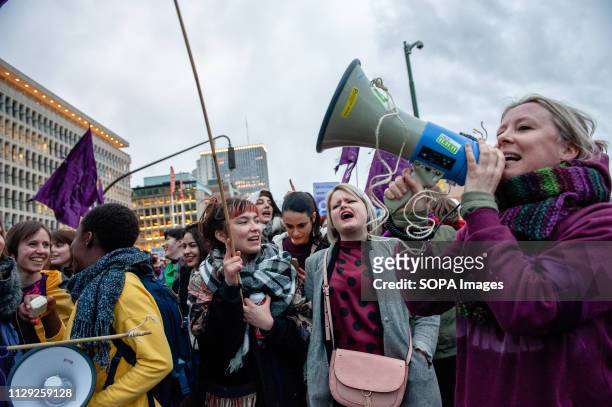 Protester is seen chanting slogans on a megaphone during the demonstration. Several organizations called for a demonstration and also for the first...
