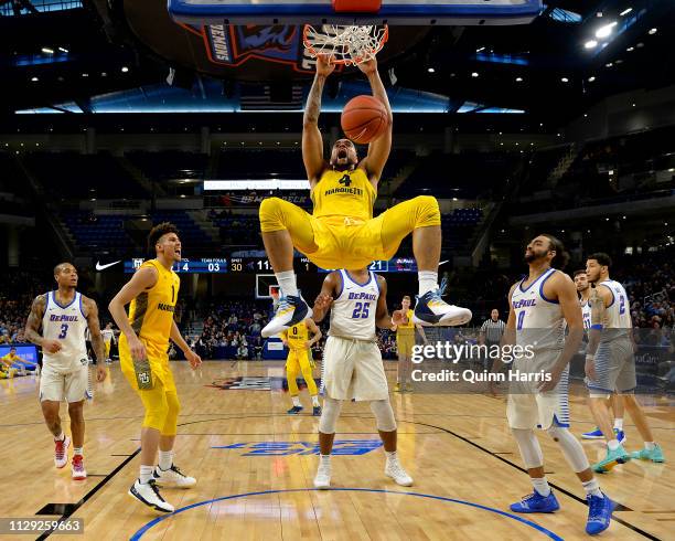 Theo John of the Marquette Golden Eagles reacts after dunking the ball against the DePaul Blue Demons at Wintrust Arena on February 12, 2019 in...