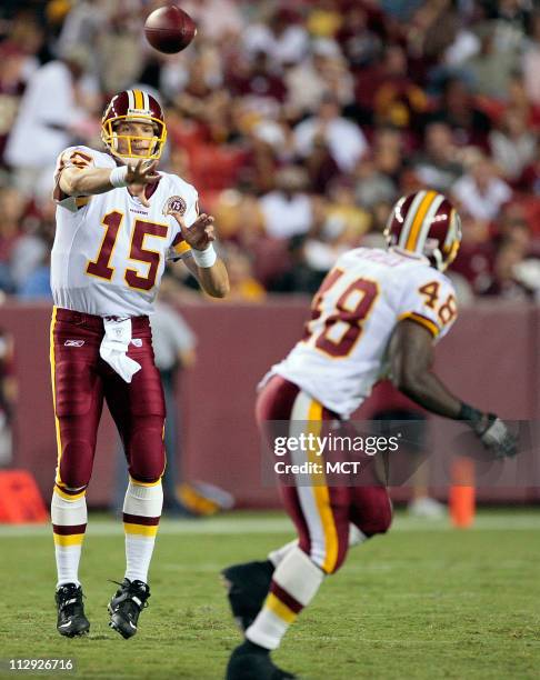 Washington Redskins quaterback Todd Collins completes a pass to teammante Derrick Blaylock during their preseason football game against the...