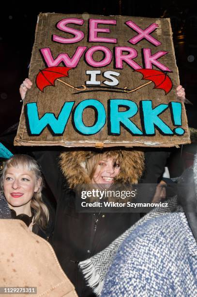 Hundreds of people take part in a protest against discrimination of sex workers held on International Women's Day at Leicester Square in London....