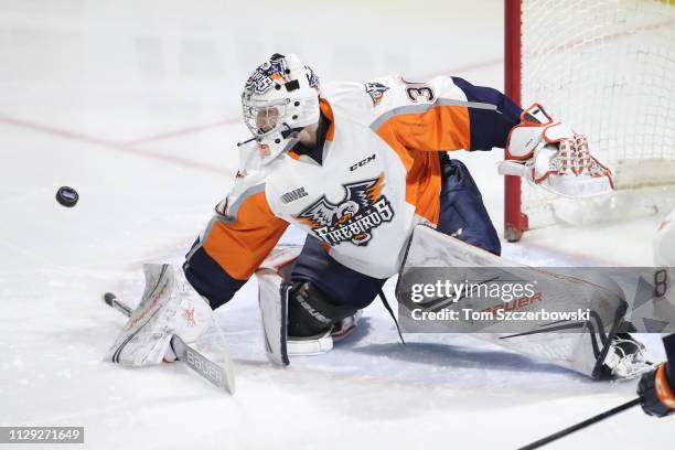 Emanuel Vella of the Flint Firebirds makes a blocker save in the first period during OHL game action against the London Knights at Budweiser Gardens...