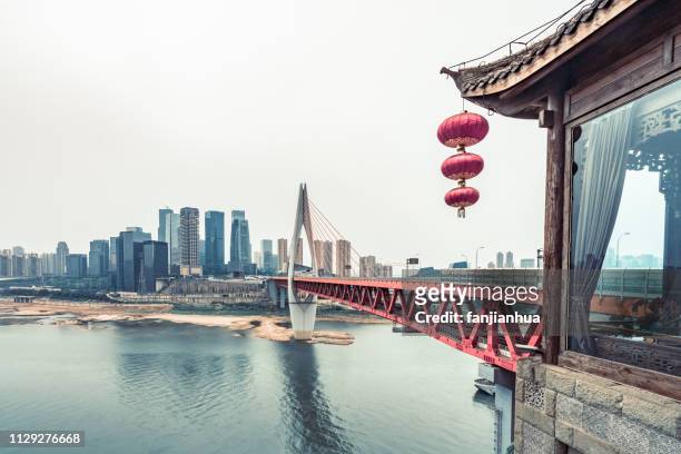qianximen bridge with chongqing skyline against sky - china lantern stock pictures, royalty-free photos & images