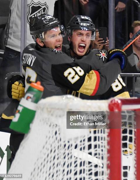 Paul Stastny and Nate Schmidt of the Vegas Golden Knights celebrate after Stastny assisted Schmidt on a second-period goal against the Arizona...