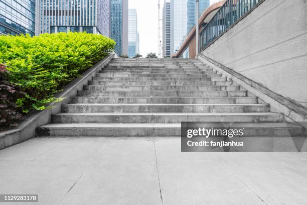 empty staircase between modern office buildings - concrete stairs stock pictures, royalty-free photos & images