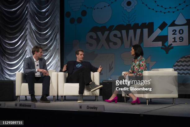 Cameron Winklevoss, president and co-founder of Gemini Trust Co., center, speaks as Tyler Winklevoss, chief executive officer and co-founder of...