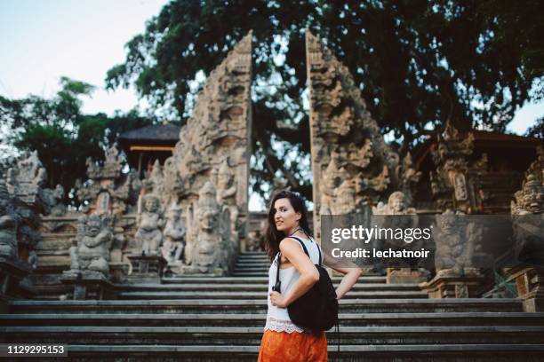 young tourist woman traveling in bali, indonesia - bali temples stock pictures, royalty-free photos & images