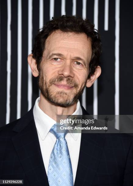 Adam Godley arrives at the premiere of Netflix's "The Umbrella Academy" at the ArcLight Hollywood on February 12, 2019 in Hollywood, California.