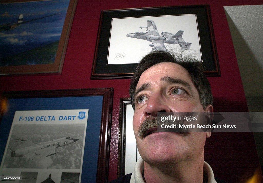 Jeff Fox poses for photograph at his home near Surfside Beac