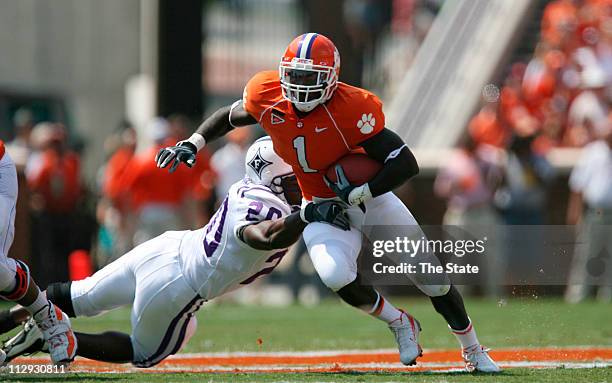 Clemson junior running back James Davis rushes past Furman senior linebacker Gary Nelson during the first quarter, Saturday, September 15 as Clemson...