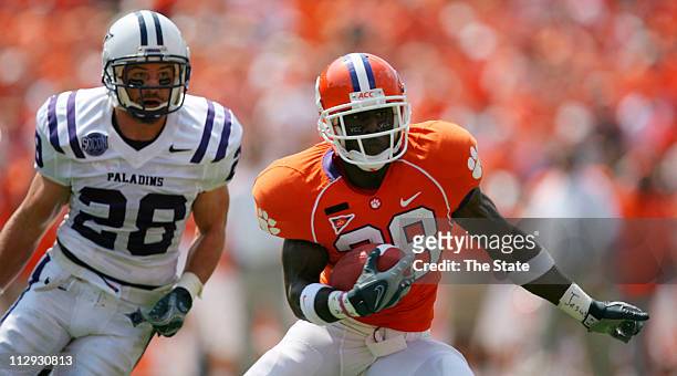 Clemson sophomore running back C.J. Spiller, right, gets past Furman junior free safety Thomas Twitty after catching one of his two receptions during...