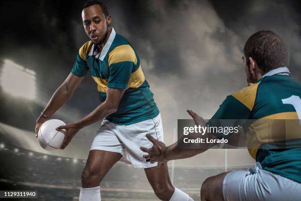 two rugby players in a game - rugby team stock pictures, royalty-free photos & images