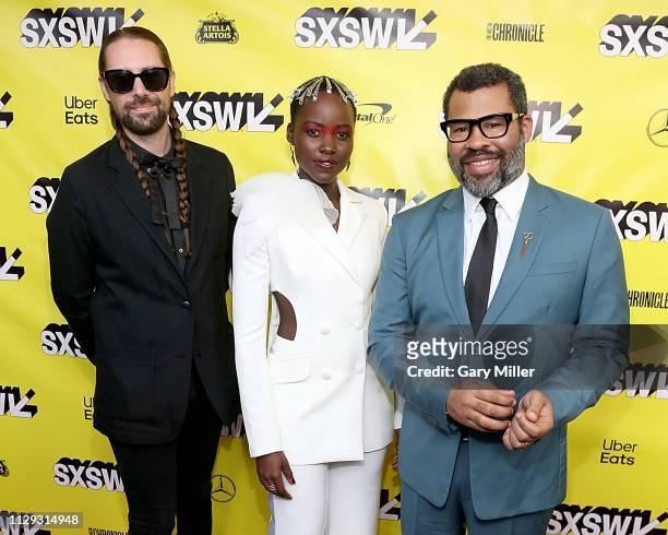 Ian Cooper, Lupita Nyong'o and Jordan Peele attend the premiere of "Us" at the Paramount Theater during the 2019 SXSW Conference And Festival on...