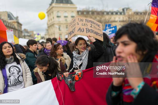 Women gather on the Place de la République during a demonstration to highlight the pay gap between men and women, in Paris, France, on March 8, 2019.