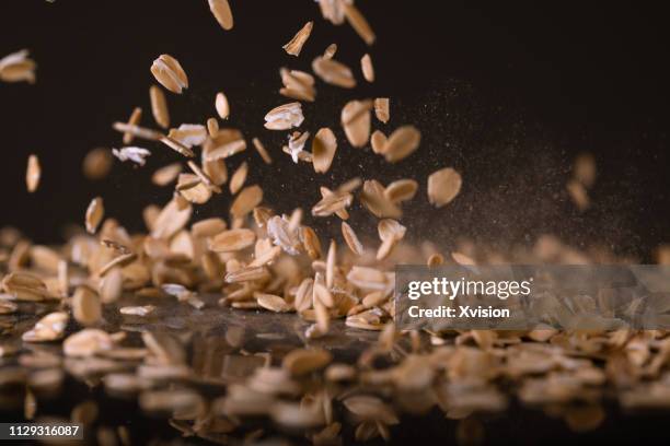 oats flake dancing captured with high speed sync"n - oats stock-fotos und bilder